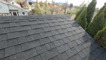 Grey,asphalt,shingles,on,roof,of,home.,new,roof,installed