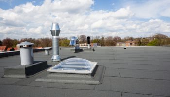 Inox,chimney,on,the,flat,roof,in,the,city